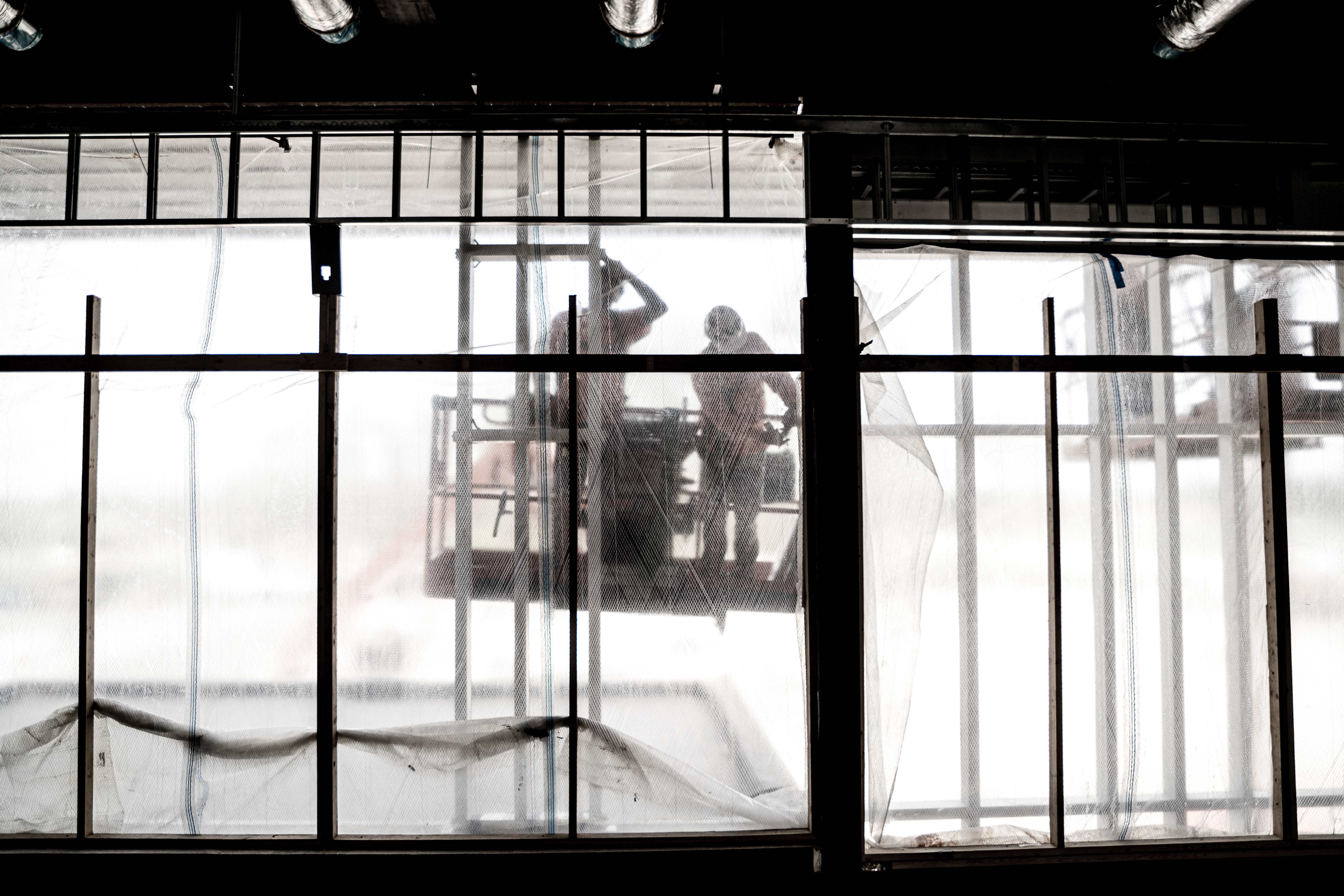 Construction workers on a lift